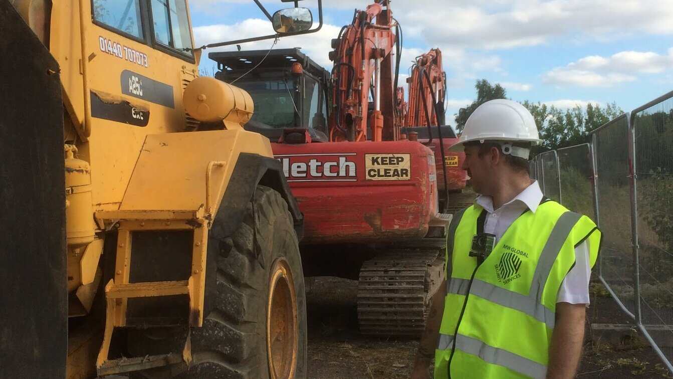 Security guard completing a patrol at an active construction project