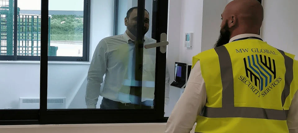 Uniformed security officer protecting a commercial and operational site