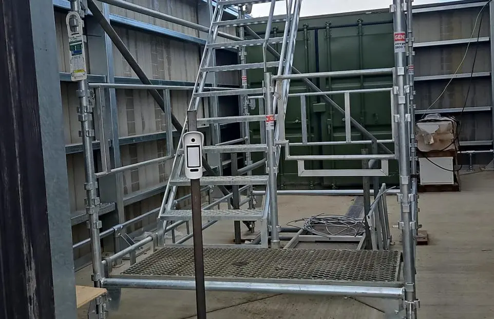Security officer reviewing access and perimeter arrangements on a construction project