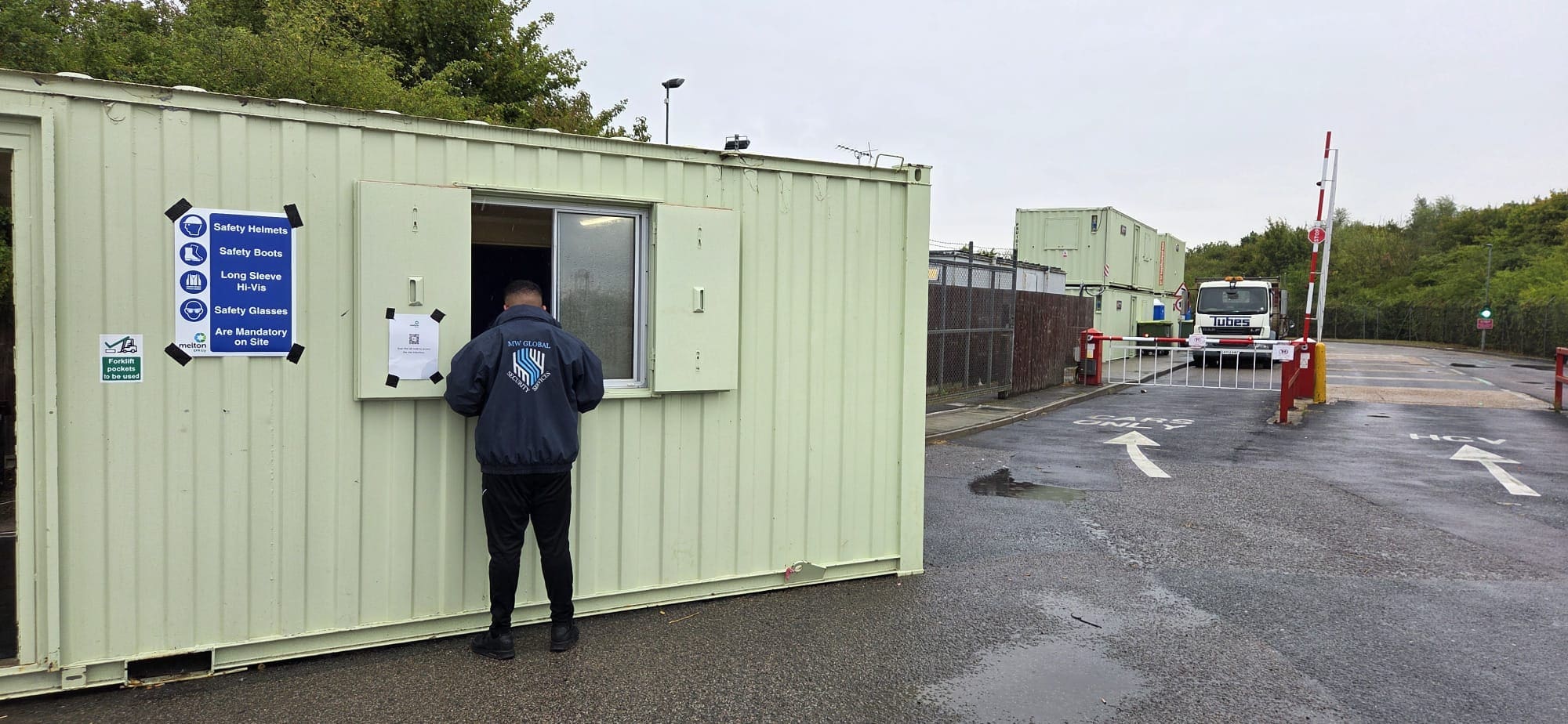 Security officer managing a gatehouse and vehicle access point