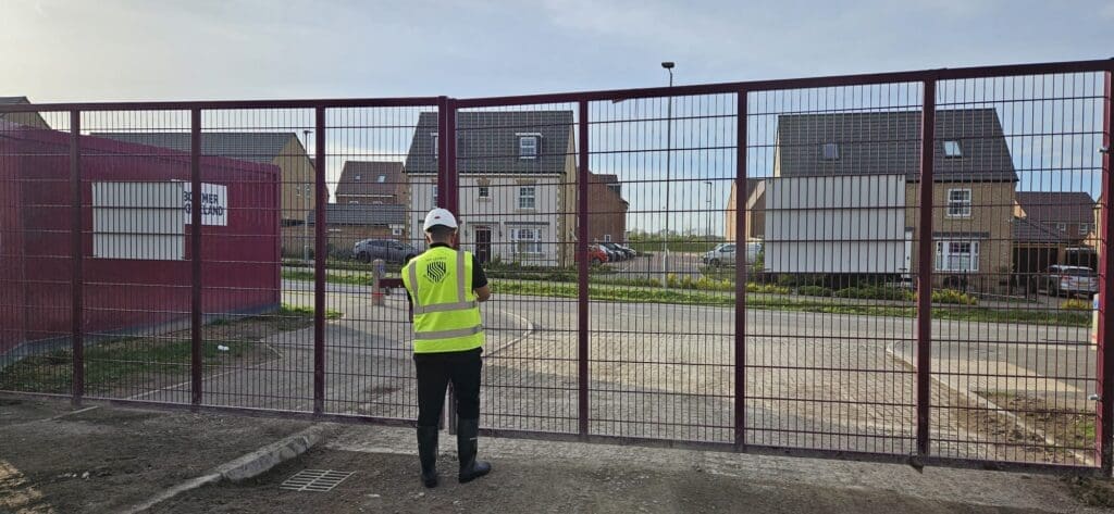 MW Global Security guard carrying out access and patrol duties at a Norwich construction site