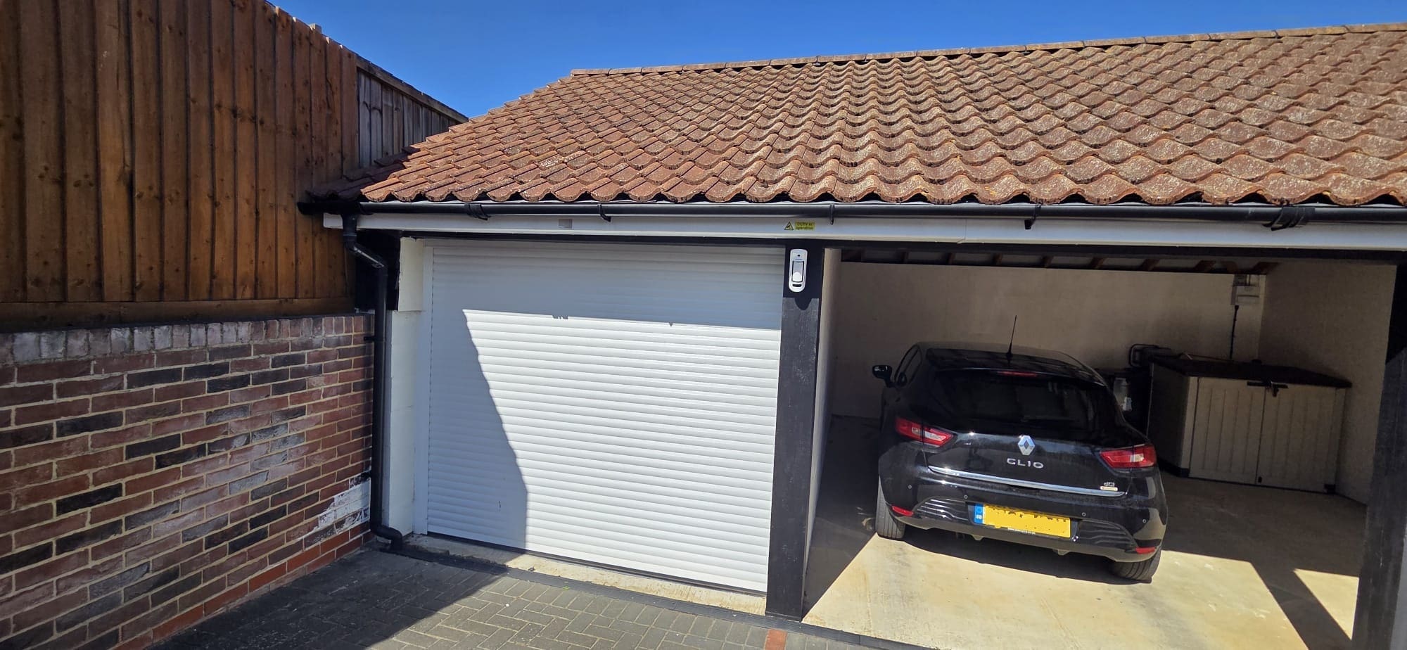 Outdoor alarm detector protecting a residential garage and outbuilding