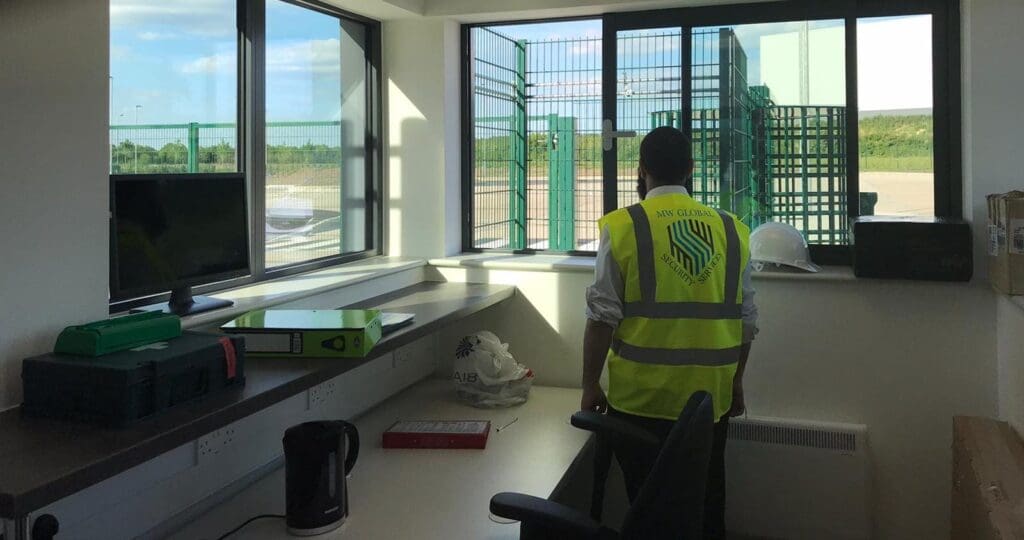 MW Global security officer monitoring access at an operational industrial site