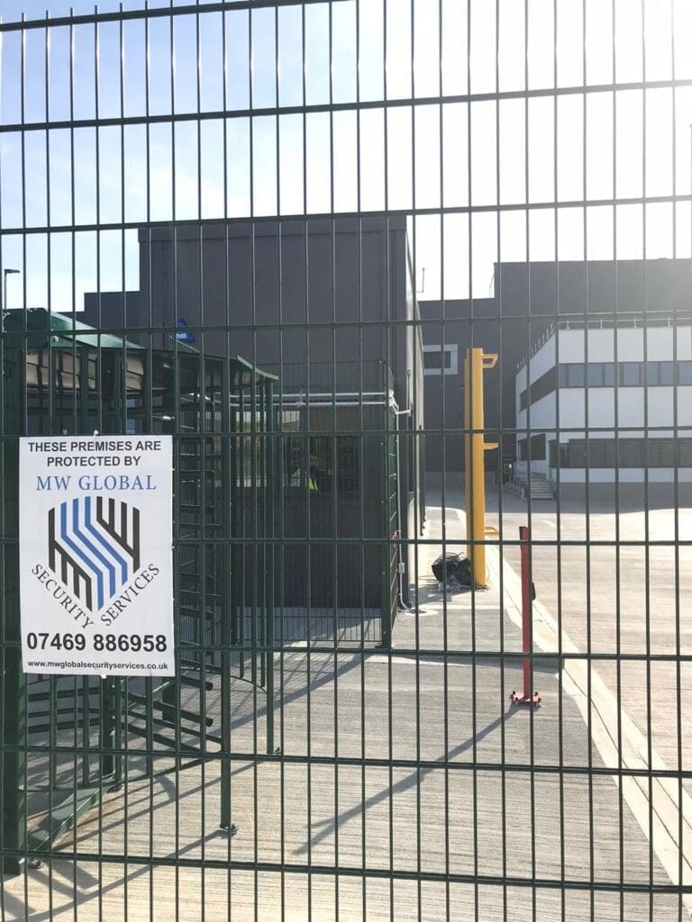 MW Global security officer managing access at a commercial site in Cambridge