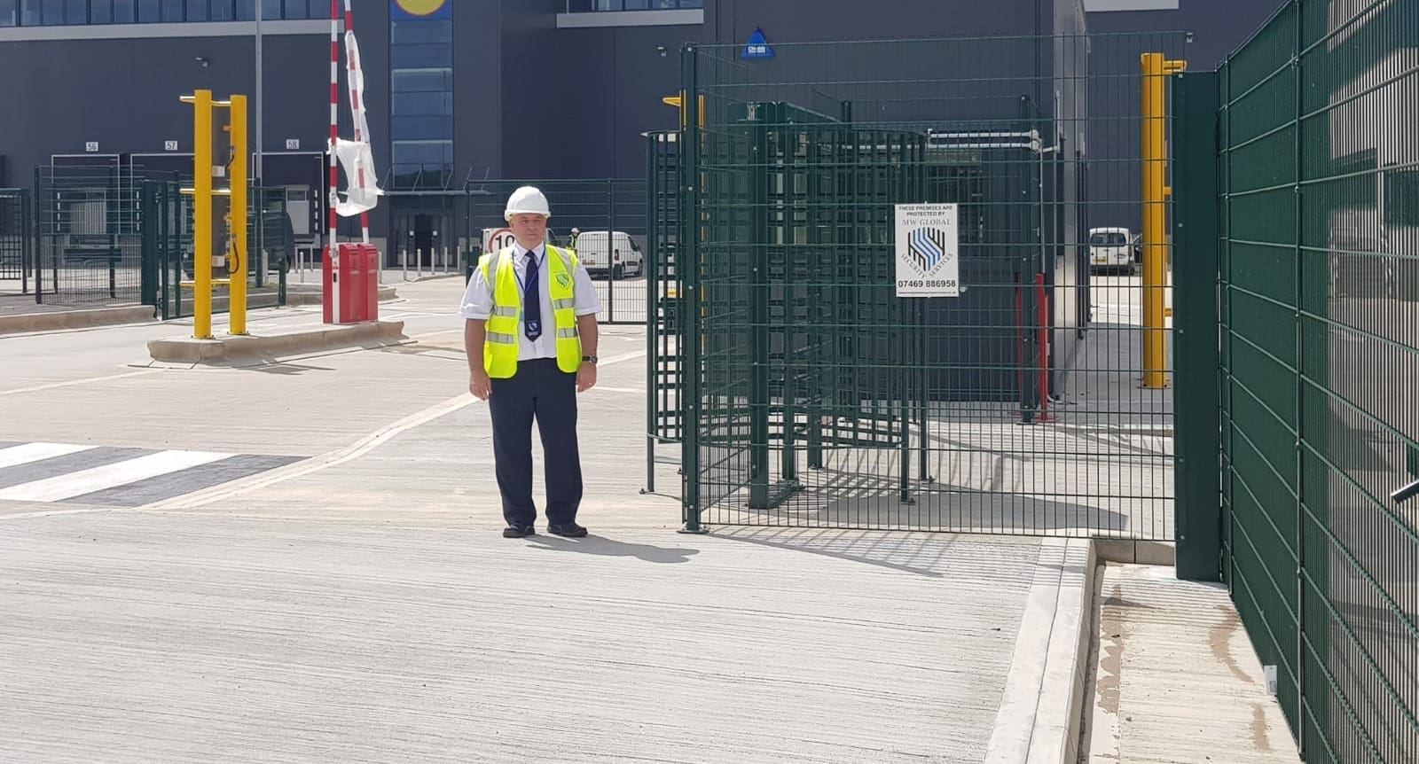 MW Global security officer managing access at a logistics and warehousing site