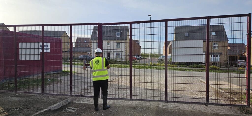 MW Global Security officer controlling access at a residential construction site