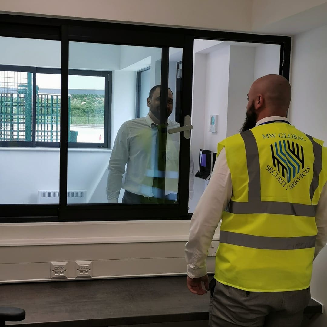 MW Global security officer carrying out access control duties at commercial premises