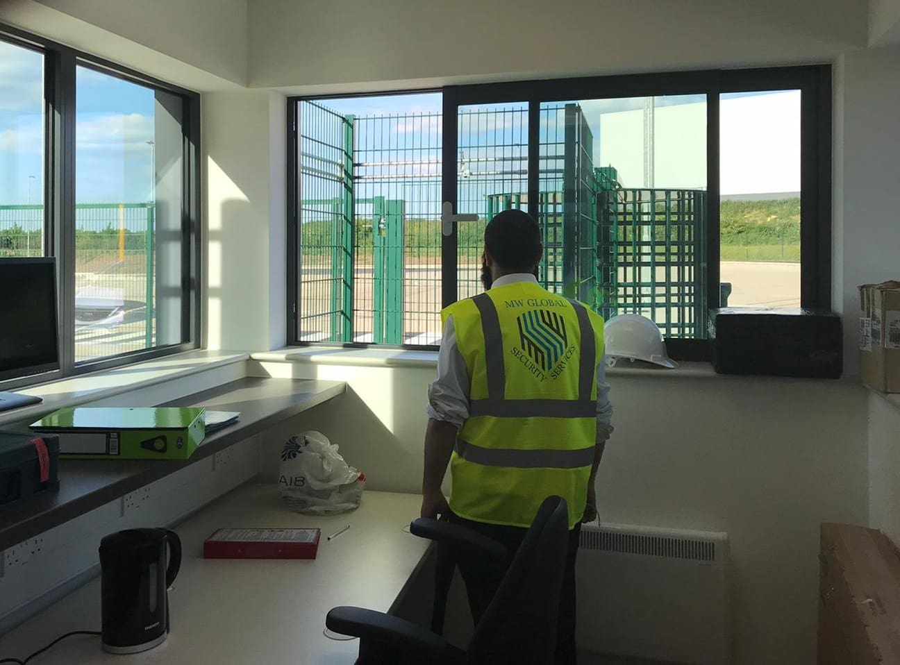 Security company near me, MW Global Security guard in gatehouse.