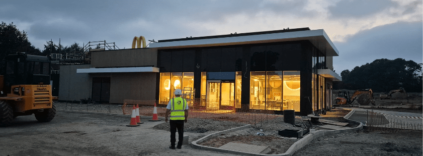 Security officer carrying out an external commercial site patrol