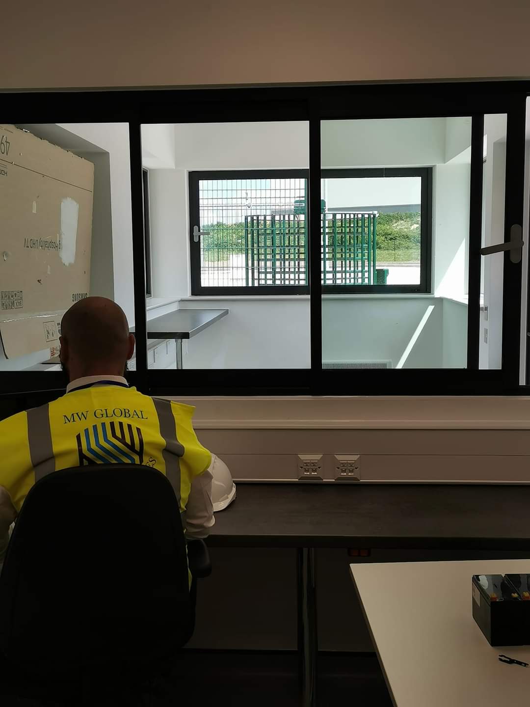 Security officer completing site security records and reporting