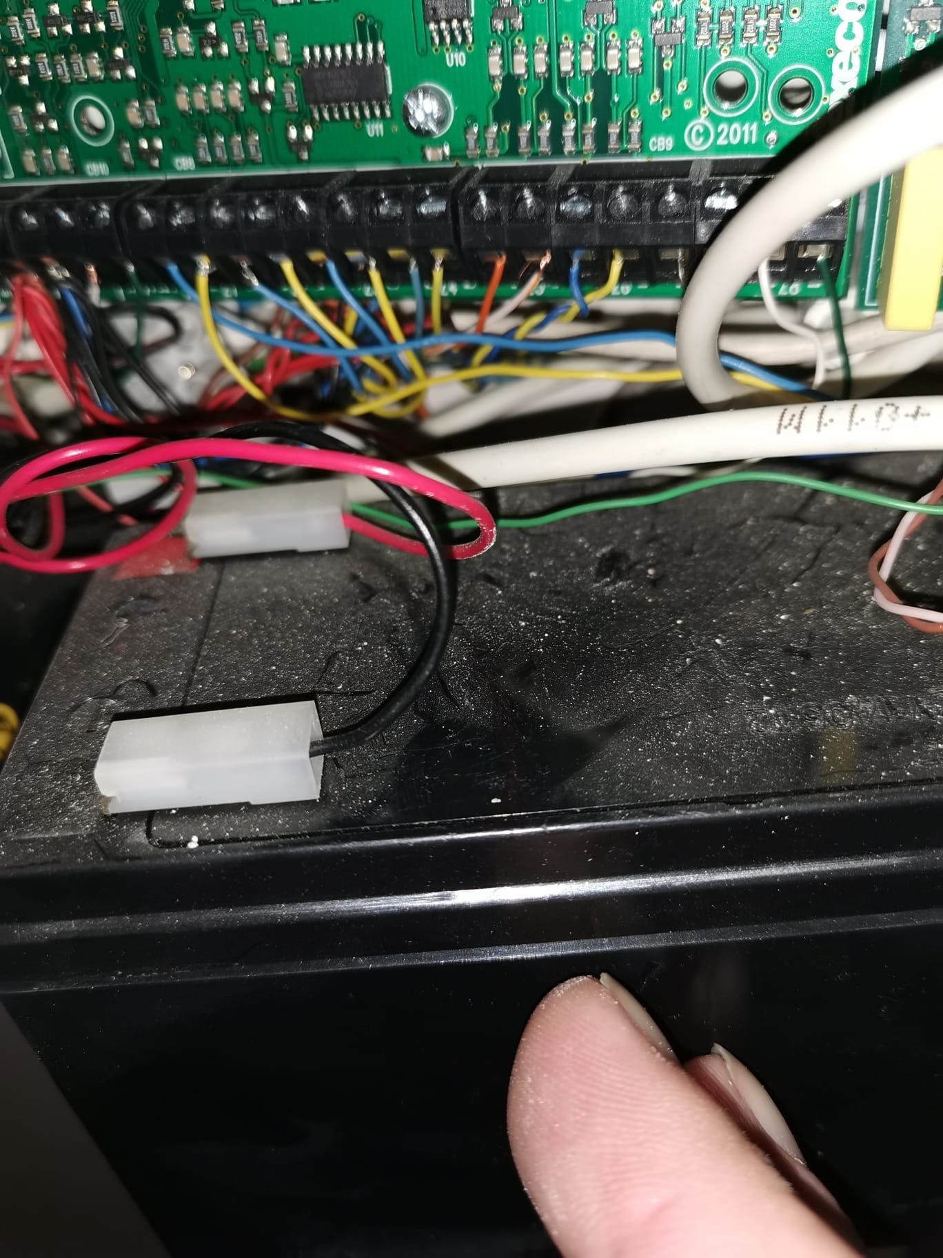 Existing wired intruder alarm control panel opened for fault diagnosis and servicing